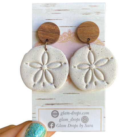 Clay sand dollars with wood studs