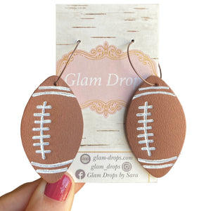 Genuine leather footballs on hoops