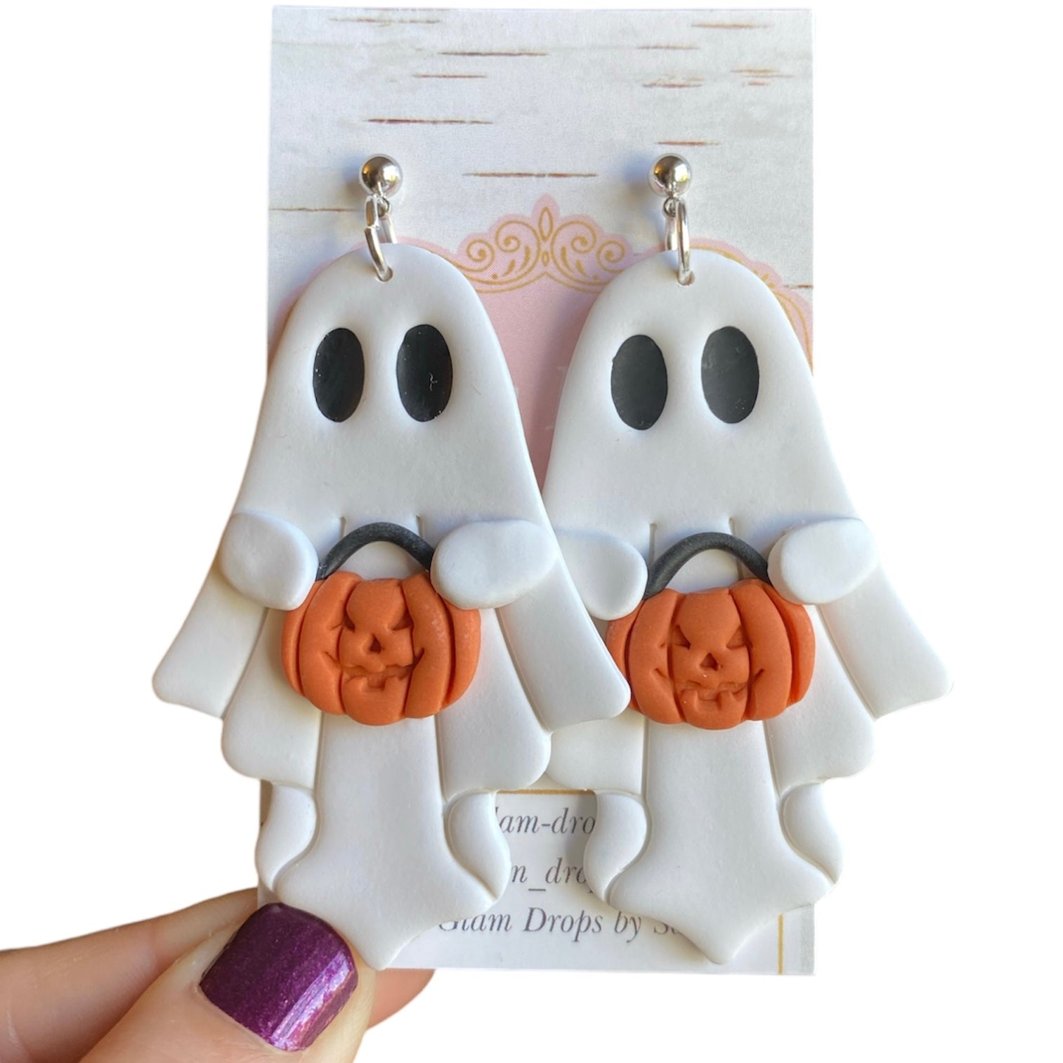 Clay ghost with pumpkin candy bucket dangles